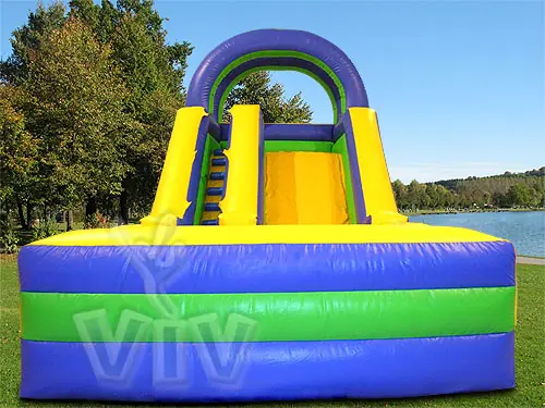 Inflatable slide with safety barriers